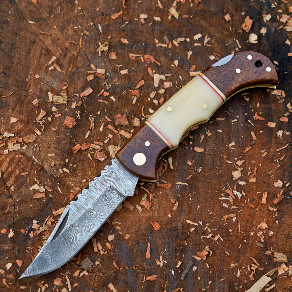 Horned Hunter Damascus folding knife with wood and bone handle