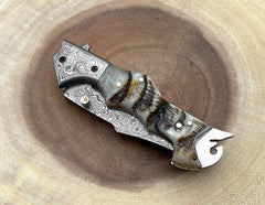 Handmade Damascus folding pocket knife with ram horn handle and leather sheath