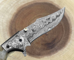 Handmade Damascus folding pocket knife with ram horn handle and leather sheath