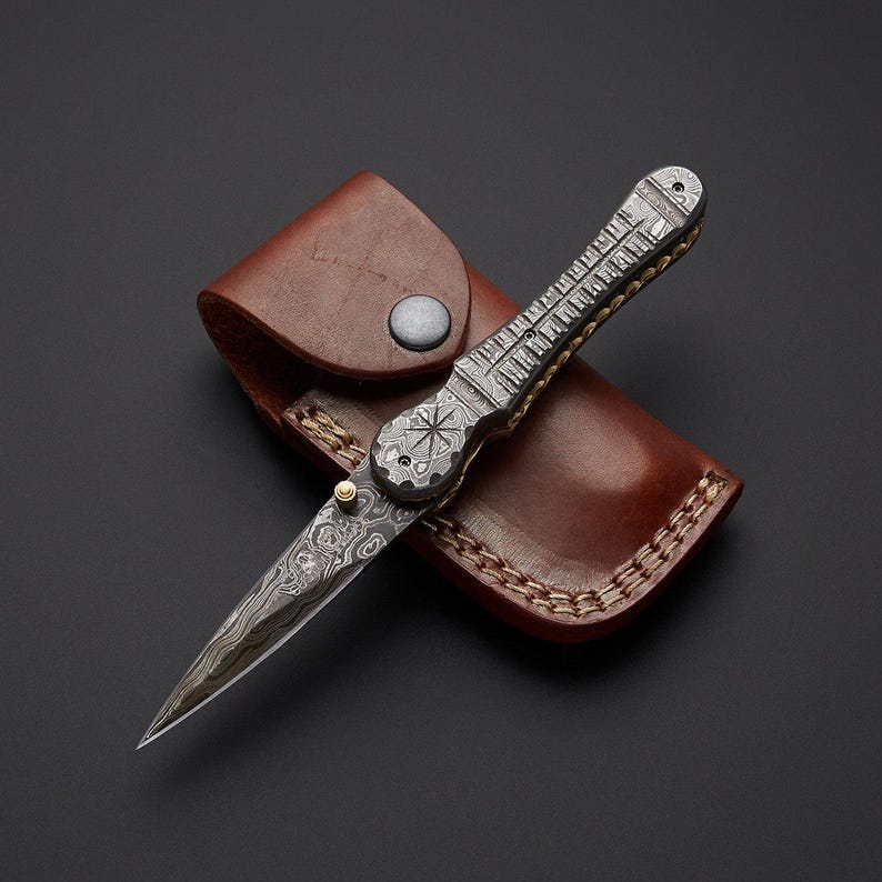 Handcrafted Damascus steel folding pocket knife with leather pouch