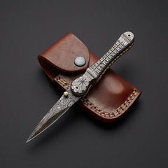 Handcrafted Damascus steel folding pocket knife with leather pouch