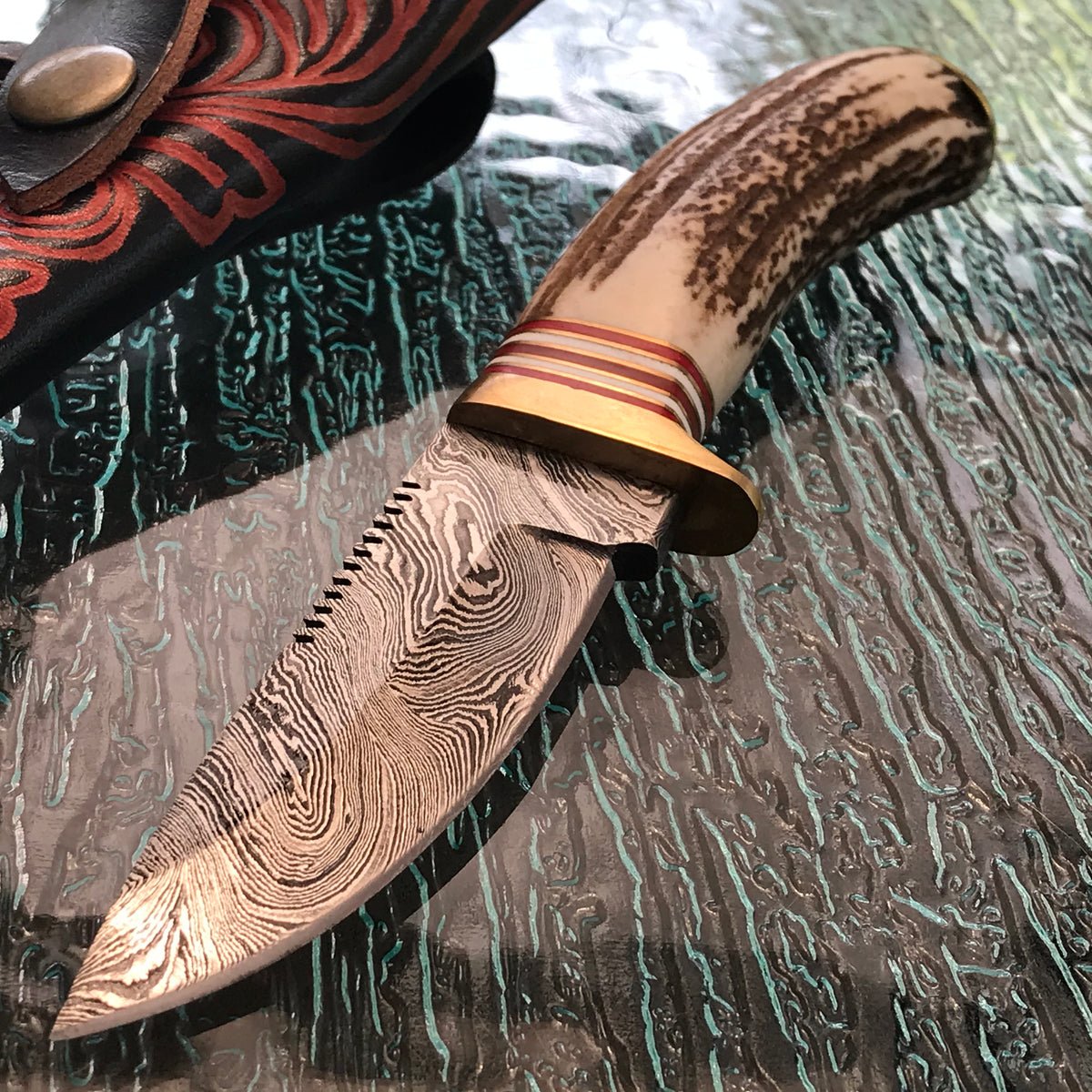 Handmade Damascus steel skinning knife with stag handle and sheath