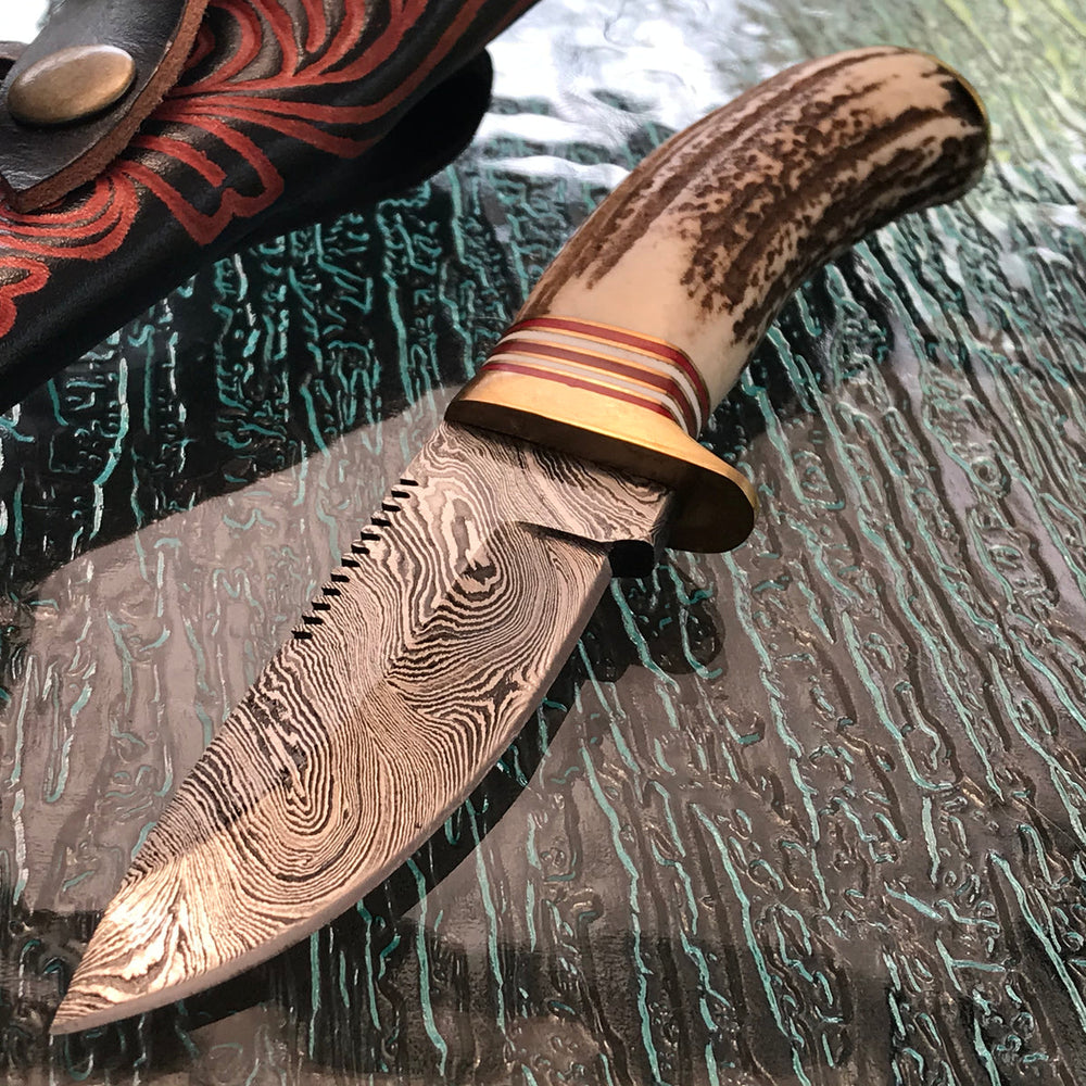 Handmade Damascus steel skinning knife with stag handle and sheath
