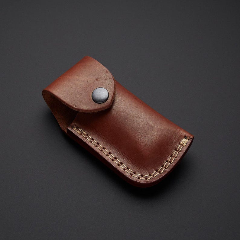 Handcrafted Damascus steel folding pocket knife with leather pouch