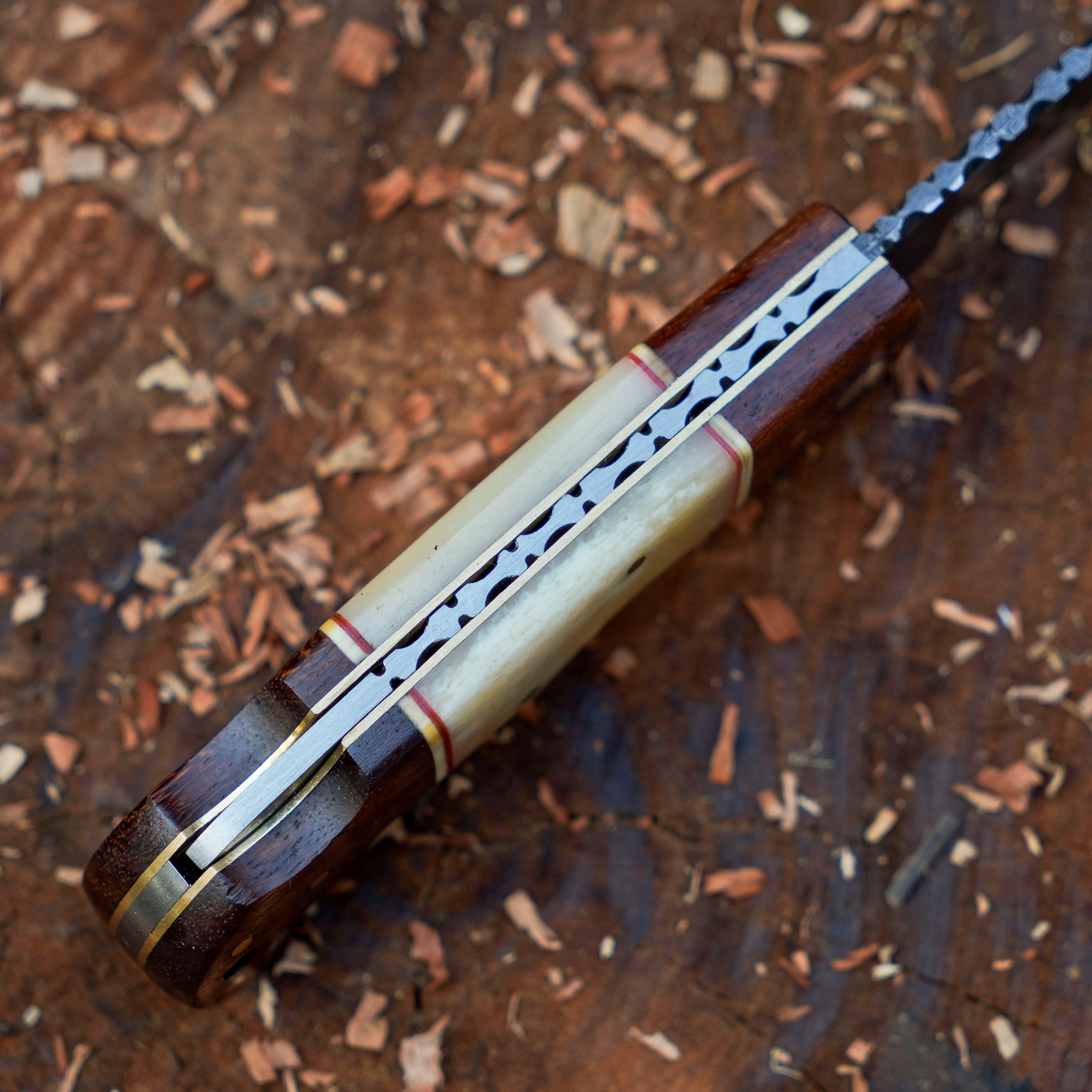 Horned Hunter Damascus folding knife with wood and bone handle