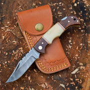 Horned Hunter Damascus folding knife with wood and bone handle