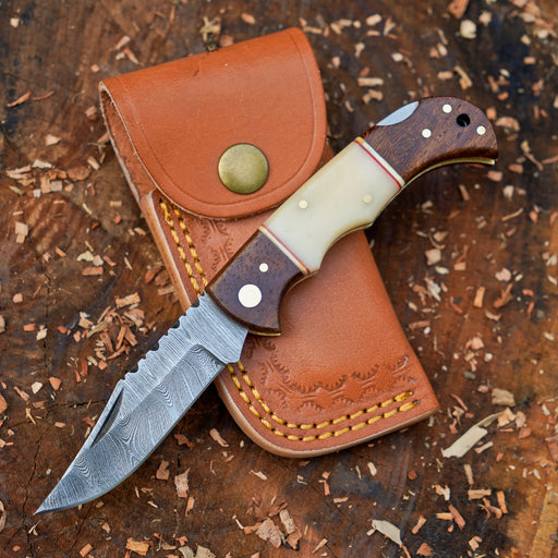 Horned Hunter Damascus folding knife with wood and bone handle
