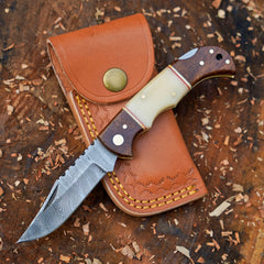 Horned Hunter Damascus folding knife with wood and bone handle
