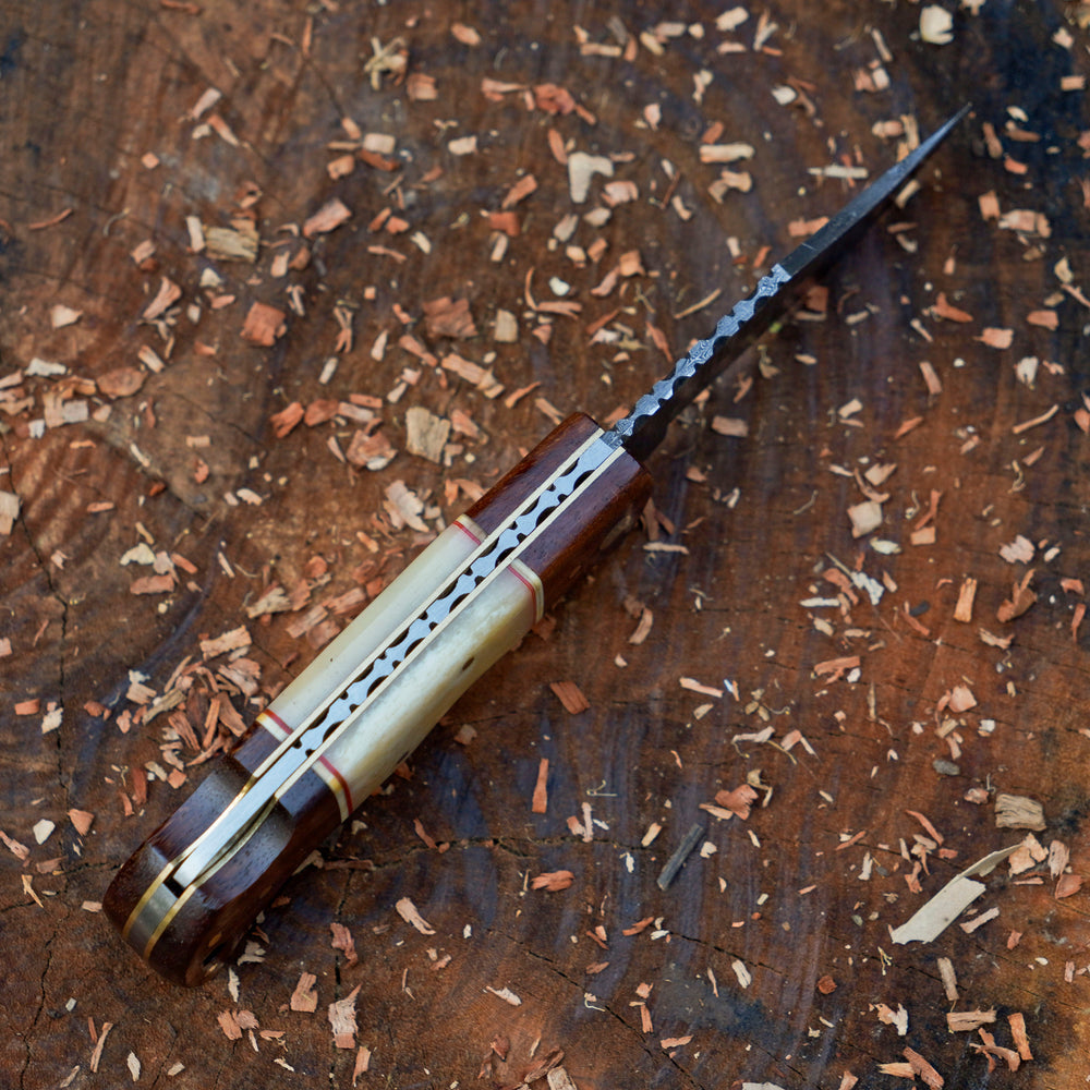 Horned Hunter Damascus folding knife with wood and bone handle