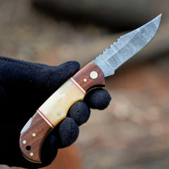 Horned Hunter Damascus folding knife with wood and bone handle