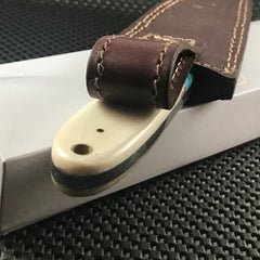 Handmade blue Damascus steel skinning knife with horn handle and leather sheath