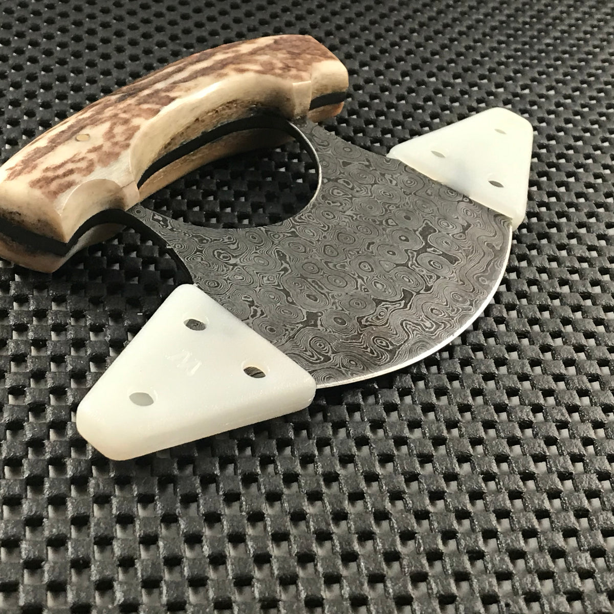 Handmade Damascus ulu knife with stag handle and leather sheath