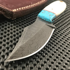 Handmade blue Damascus steel skinning knife with horn handle and leather sheath