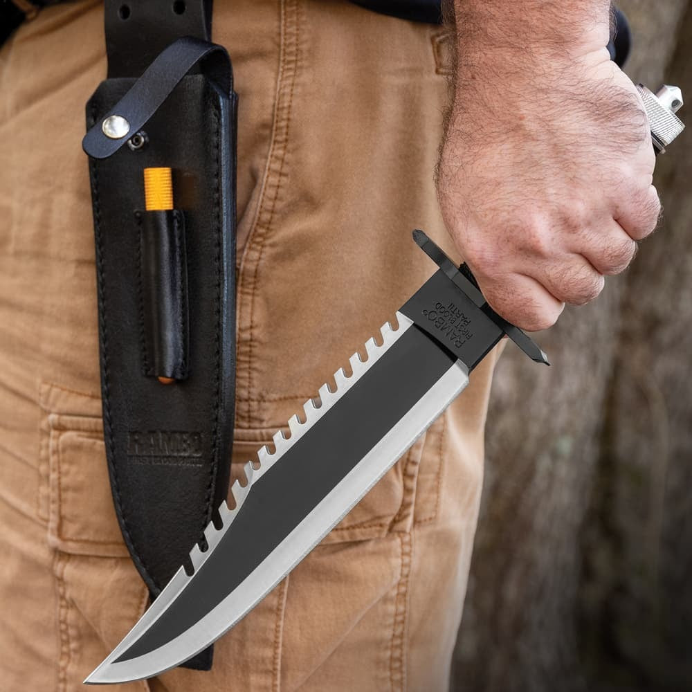John Rambo survival knife replica with black blade and leather sheath